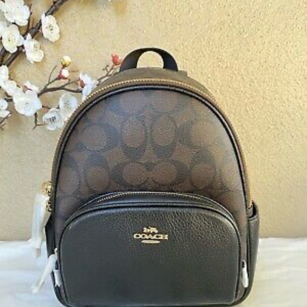 NWOT coach backpack. Tan and black medium size.